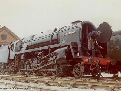29th June 1974. Driver Arthur Young can be seen hard at work cleaning out the ash from the smoke box after another busy day.
